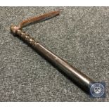 A turned-wood police truncheon