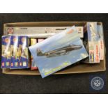 A box of plastic modelling kits of aircraft including Airfix,