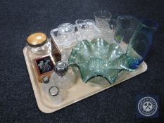 A tray of assorted glassware, silver lidded perfume bottle, two silver rimmed bottles,