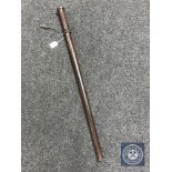 A turned wooden baton