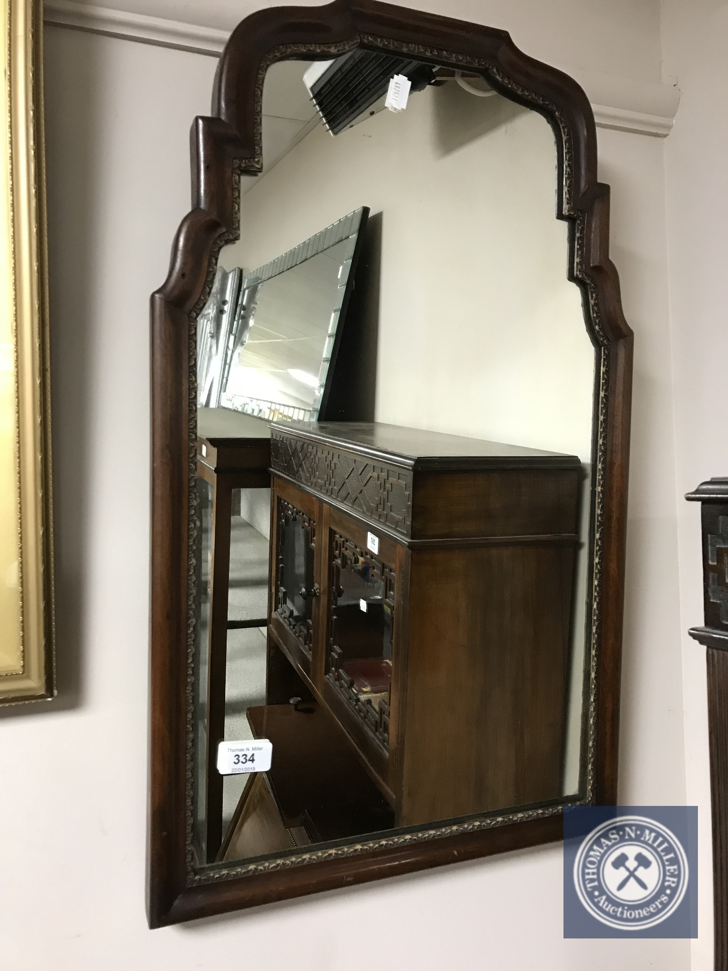 A Victorian shaped-frame mirror