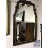 A Victorian shaped-frame mirror