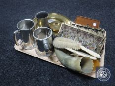 A tray of pewter tankards, brass wall plaque, bone dressing table set, tapestry purses,