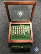A display case containing Danbury Mint uncirculated US state quarters