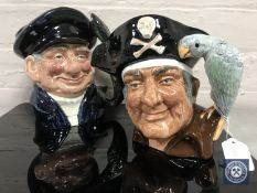 Two Royal Doulton character jugs : Long John Silver, D 6335, height 18 cm, and Lobster Man, D 6617,