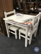 A child's table with two chairs