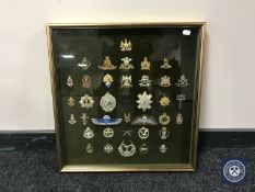 A gilt framed military montage