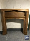 An early 20th century oak fire surround CONDITION REPORT: Overall 154cm high by