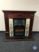 An electric fire place with tiled insert