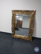 A gilt framed overmantel mirror