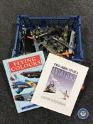 A basket containing Airfix modelling kit of a Spitfire with assorted plastic military aircraft,
