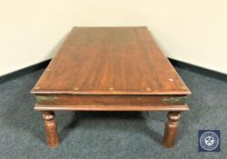 A rectangular Eastern mahogany low coffee table with metal mounts