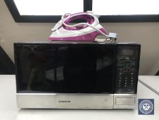 A Samsung microwave together with a Russell Hobbs steam iron