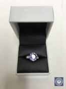 An 18ct white gold Alexandrite ring, a brilliant cut Alexandrite within a claw setting,
