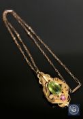 A superb quality antique 15ct gold peridot and ruby pendant with chain