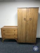 A mid 20th century walnut double door wardrobe together with a three drawer chest