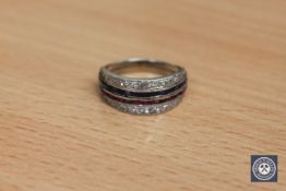 A diamond, sapphire and ruby half eternity ring,