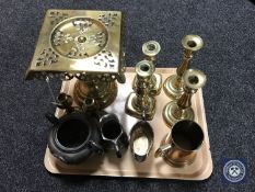 A tray of metal ware, brass trivet, candlesticks,