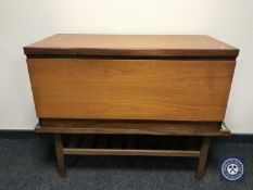 A late 20th century teak blanket box and tiled topped coffee table
