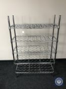 A metal five tier wine rack