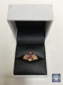 A 15ct gold ruby and citrine ring,