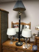 A floor lamp with shade and a pair of table lamps with shades
