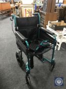 A Days folding light weight wheel chair with foot rest