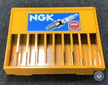 An NGK spark plug stand