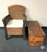 A wicker armchair and a pine blanket box