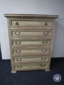 A Mexican pine six drawer chest