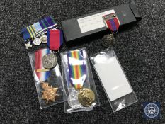 A box containing four commemorative regimental and service copy medals together with five miniature