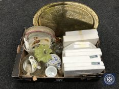 A box containing assorted collector's plates, glass ware, tea plates,