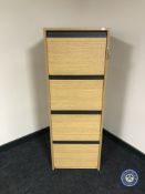 A four drawer filing cabinet with key