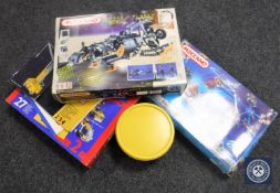 Three boxes and a tub containing Meccano