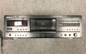 A Pioneer stereo cassette deck, CT-S830S, with manual.