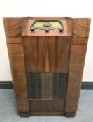 An early 20th century radio with Bakelite dial in a walnut case.