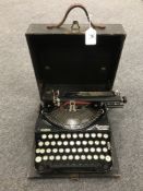 An early 20th century Remington Compact portable typewriter.