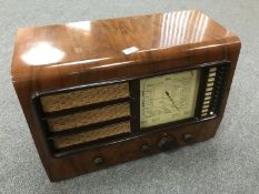 An Ekco walnut cased value radio.