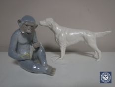 A Spanish figure of a monkey eating a banana together with a Dale Hall figure of a Setter.