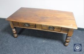 An Eastern mahogany coffee table fitted two drawers