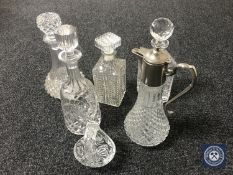 Four assorted lead crystal and cut glass decanters,