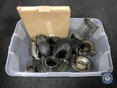 A box containing pewter tankards and measures,