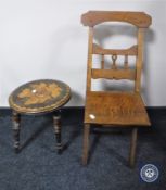 A folding Edwardian oak child's chair and a poker work milking stool