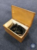 A pine box of two small circular brass wall plaques and assorted horse brasses