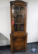 A walnut corner display cabinet