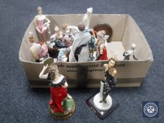 A box of contemporary Art Deco style figures