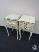Two cream and gilt bedside tables