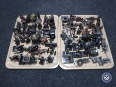 Two trays of novelty pencil sharpeners and small quantity of metal figures on stands