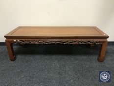 An oriental style hardwood rectangular low coffee table