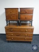 A contemporary pine and metal three drawer chest and a pair of matching bedside chests
